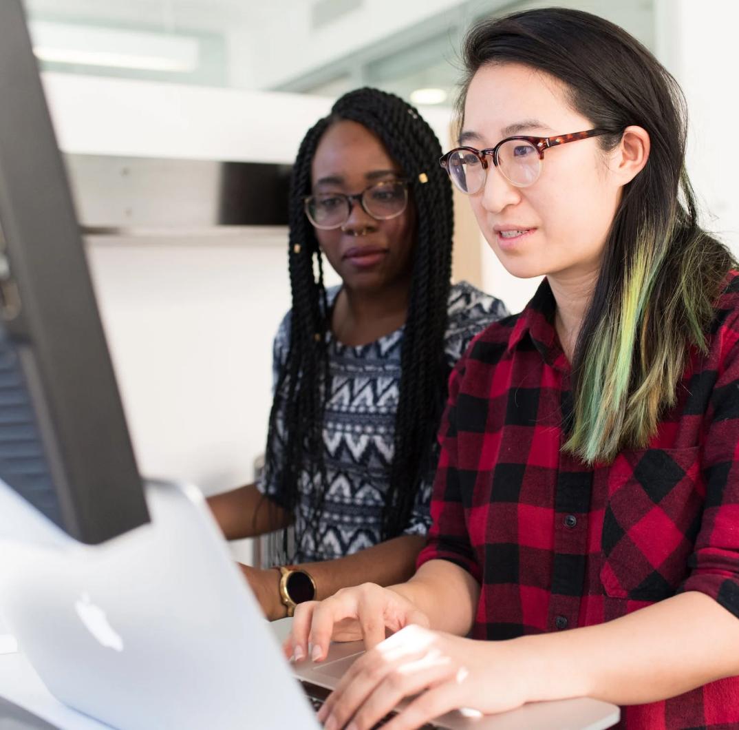 Stock photo of two developers coding