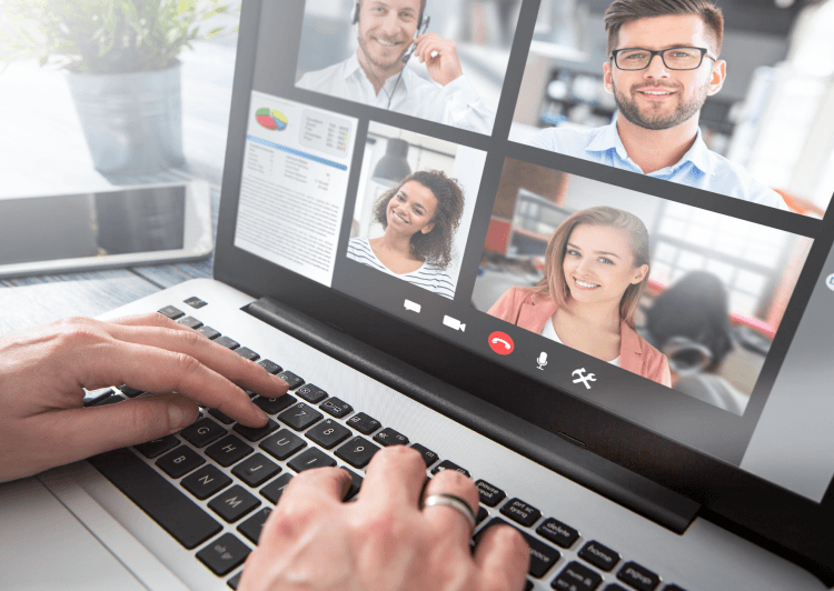 Multiple people on a video call on a laptop